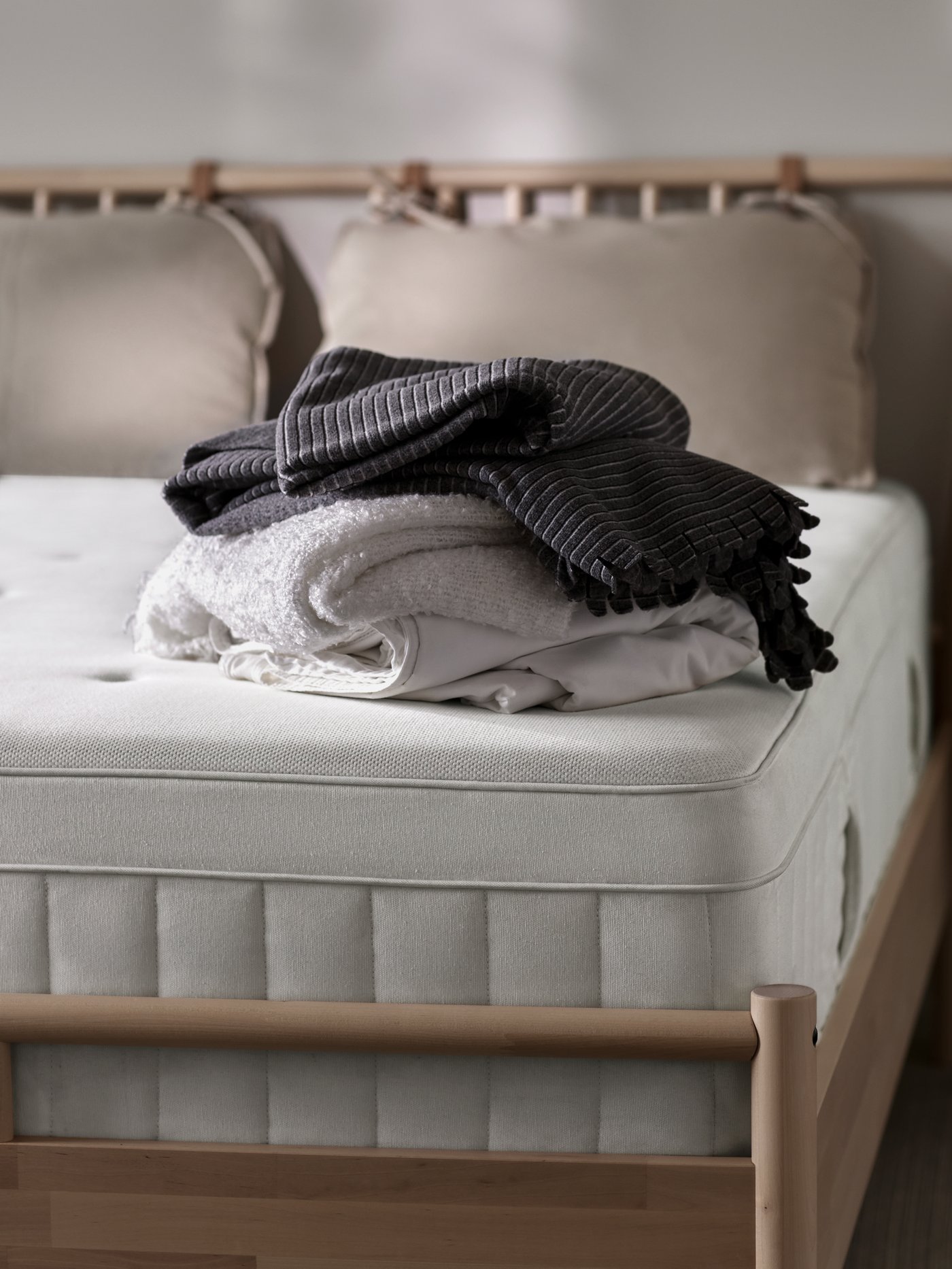 An off-white EVALI throw in the bedroom