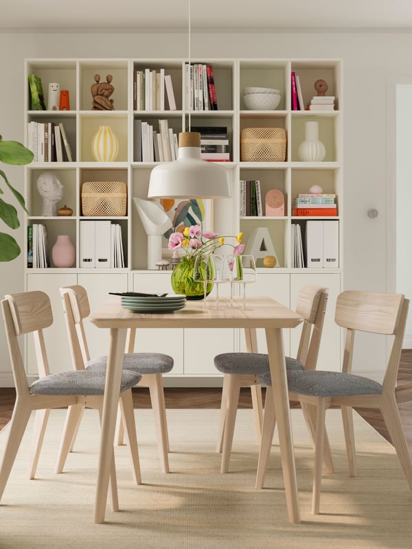 A white EKET wall-mounted shelving unit