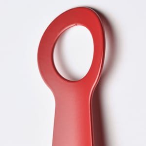 A bright red SNÖSKYFFEL shoehorn