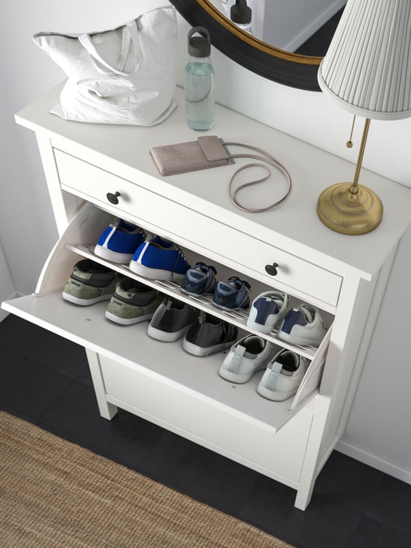 A white HEMNES shoe cabinet with 2 compartments