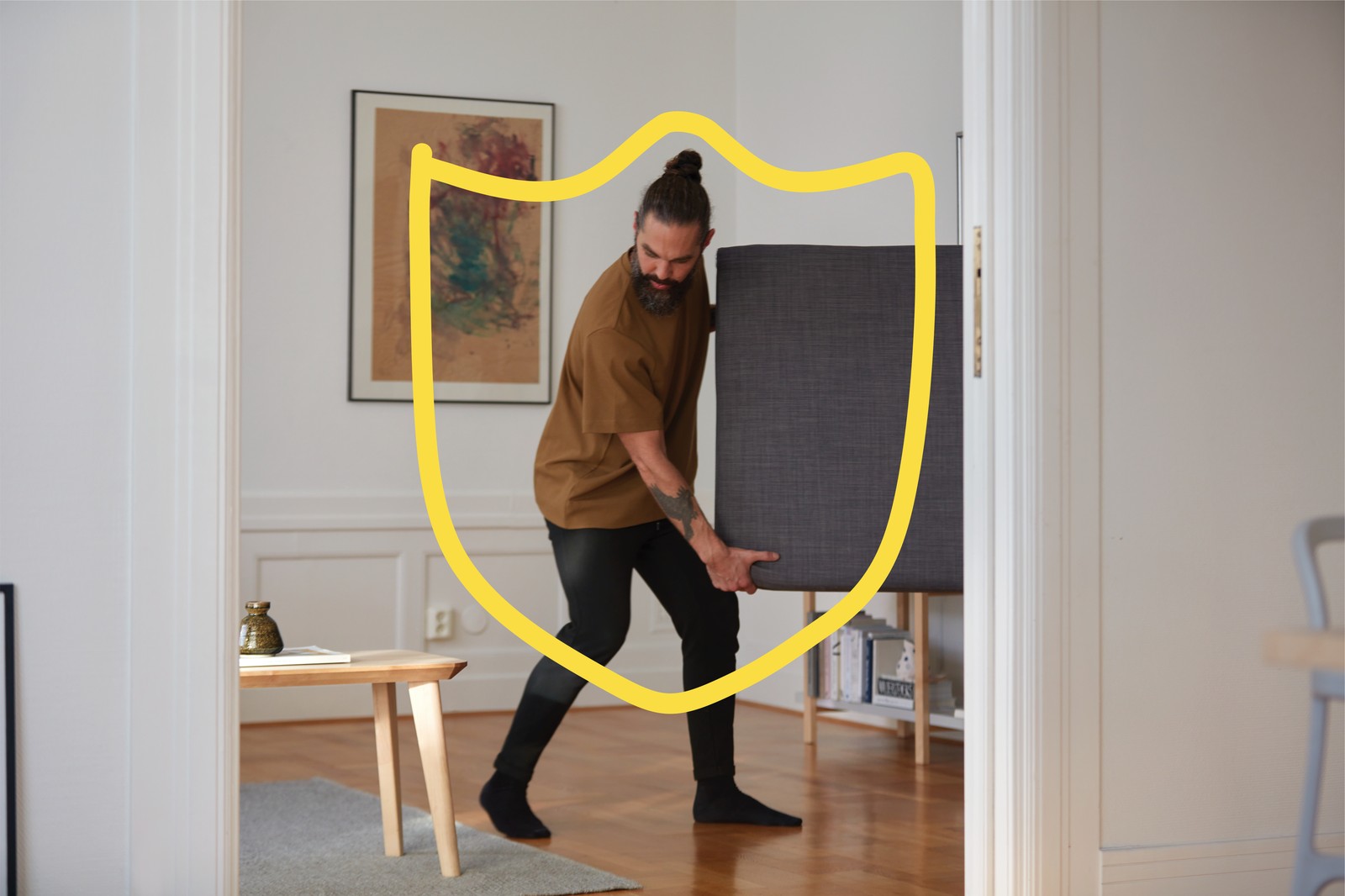 A man is transporting an old piece of furniture back to the store