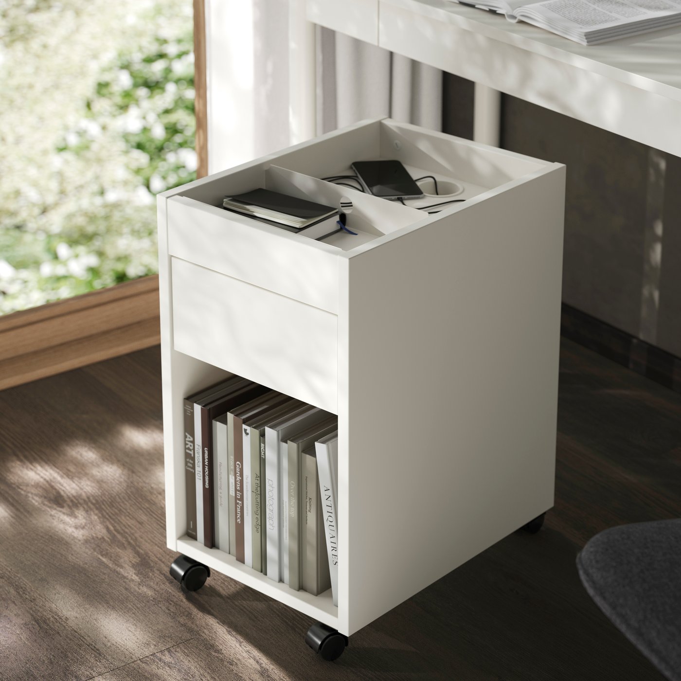 An off-white TONSTAD drawer unit on castors