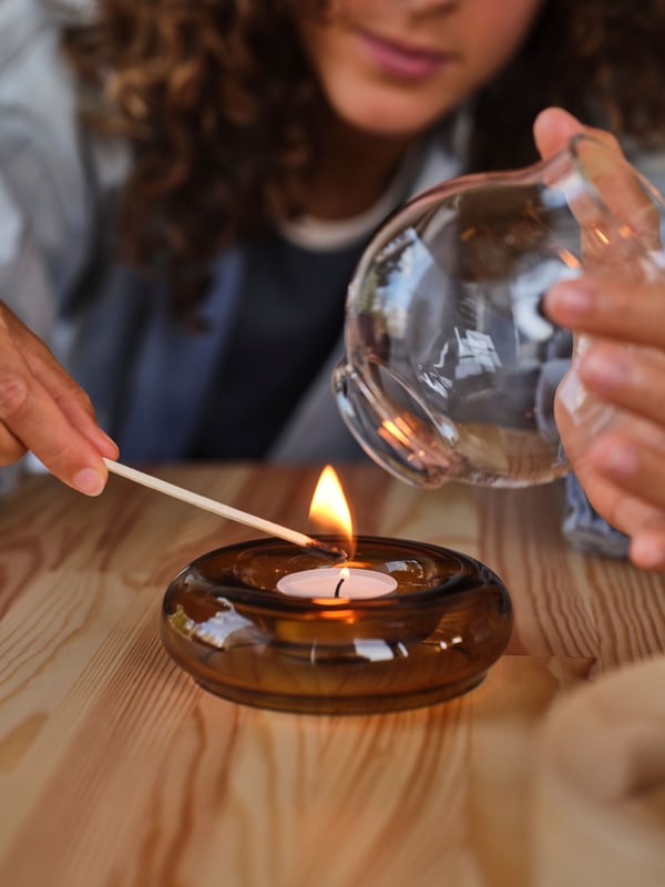 A white JUBLA unscented tealight