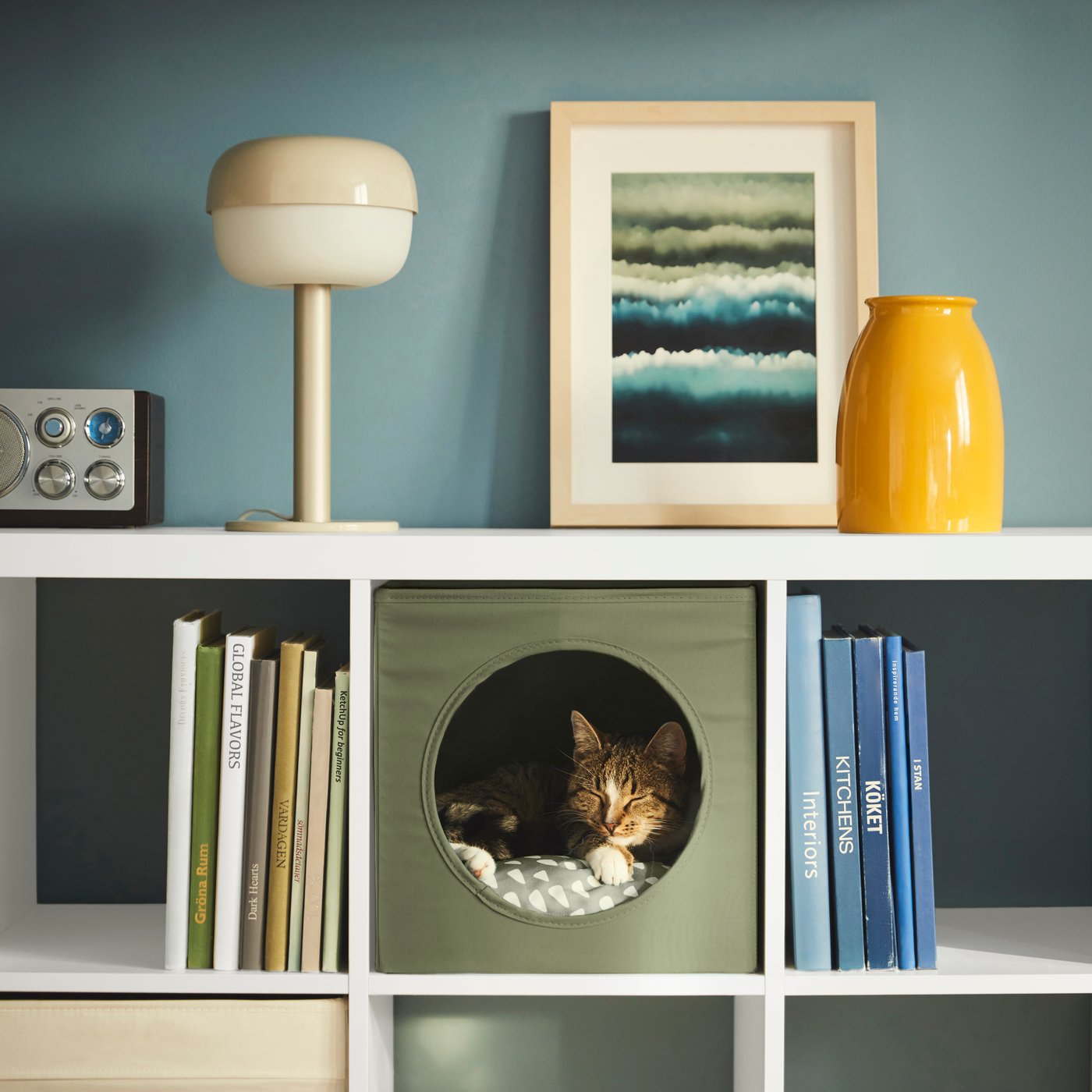 A grey-green/off-white UTSÅDD pet cushion