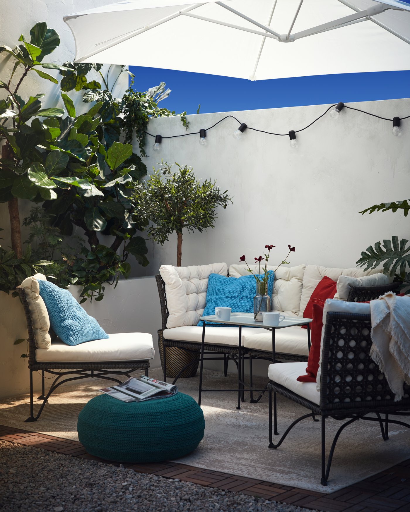 Nice terrace set with benches and a parasol 