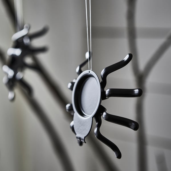 A spider black KUSTFYR tealight holder