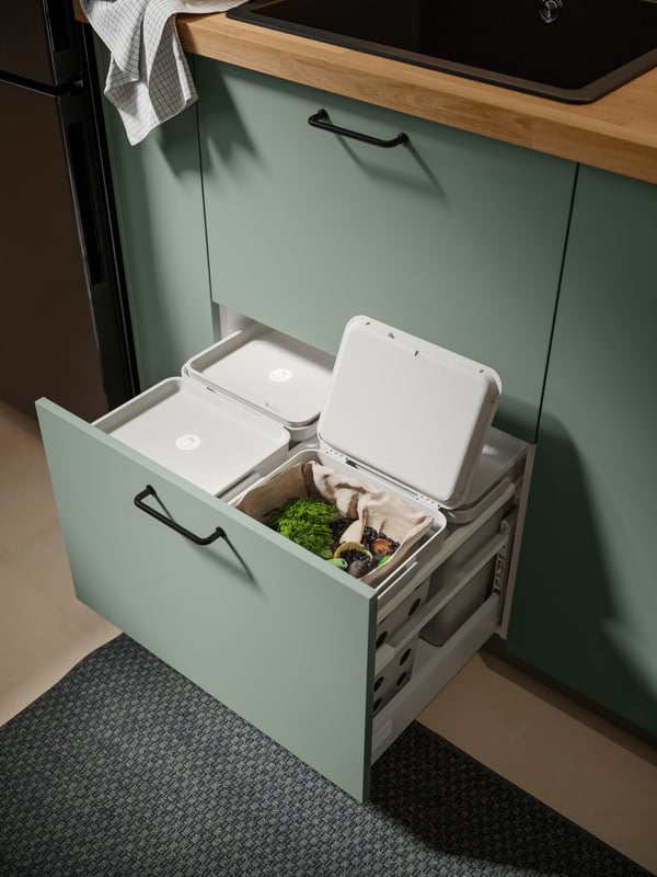 A grey-green BODARP drawer front