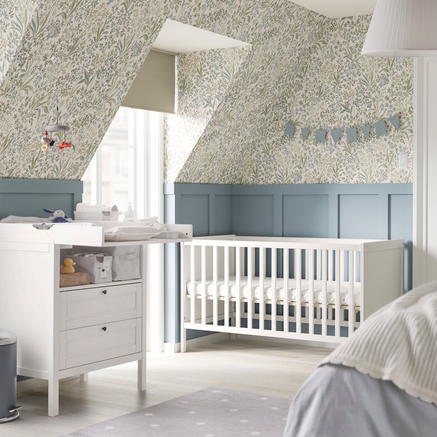 A white MYLLRA changing table with drawers