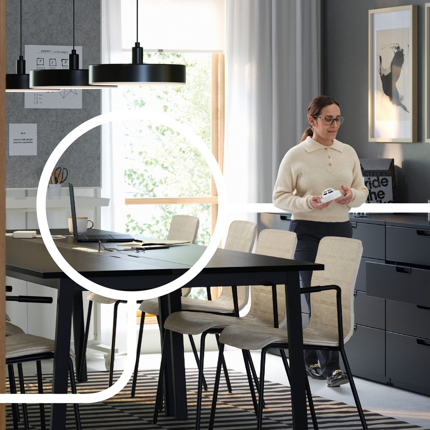 A woman in the office, behind a large conferance table.