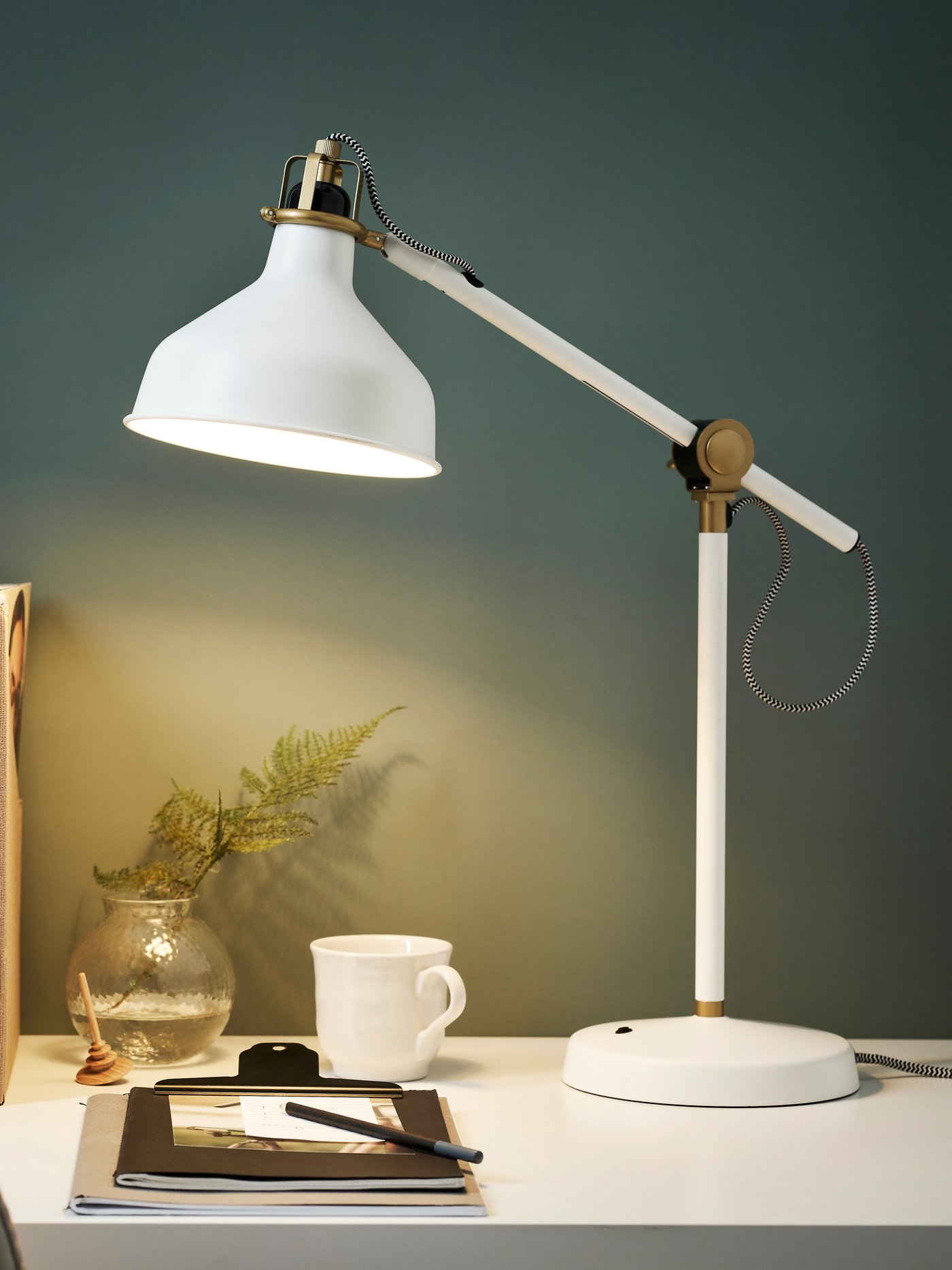White RANARP work lamp illuminating the desktop