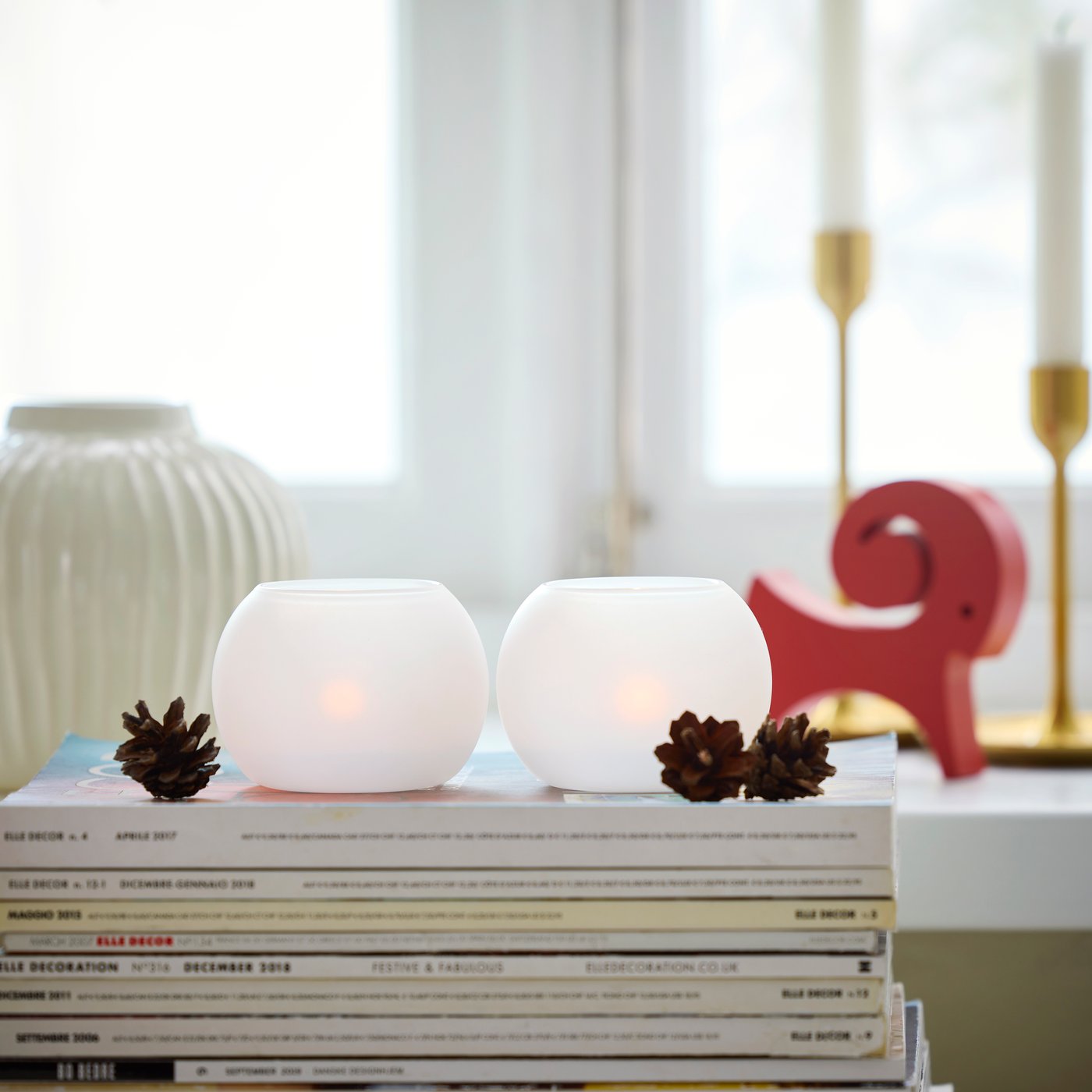 A frosted glass white VINTERFINT tealight holder