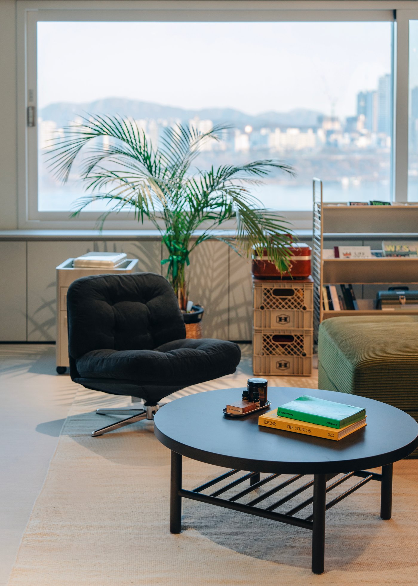 A Kelinge black DYVLINGE swivel armchair