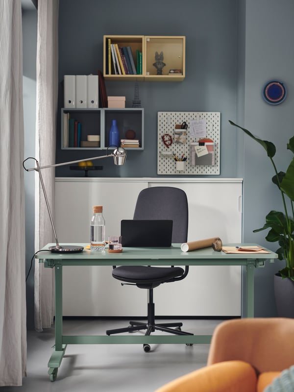 A white ELLOVEN whiteboard/noticeboard with castors