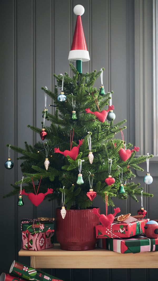 An in/outdoor/Christmas tree green VINTERFINT artificial potted plant in the NA