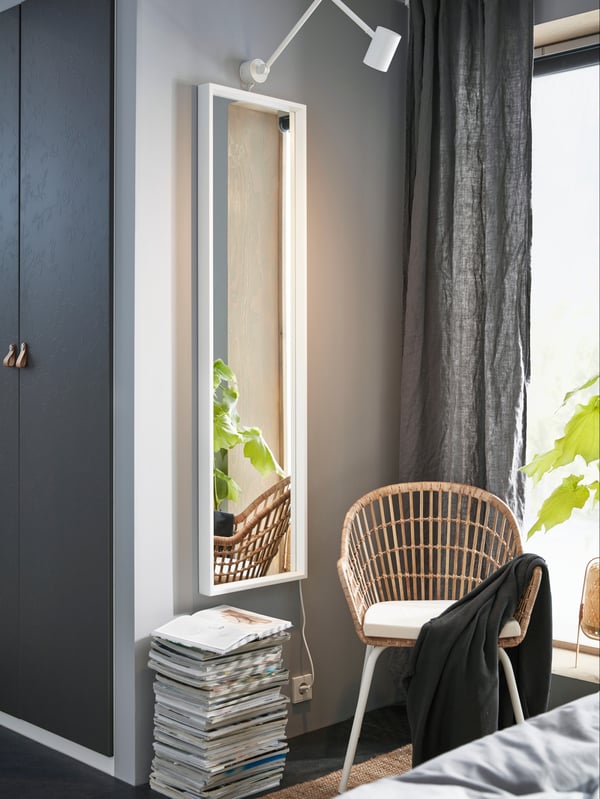 A white NISSEDAL mirror in the bedroom