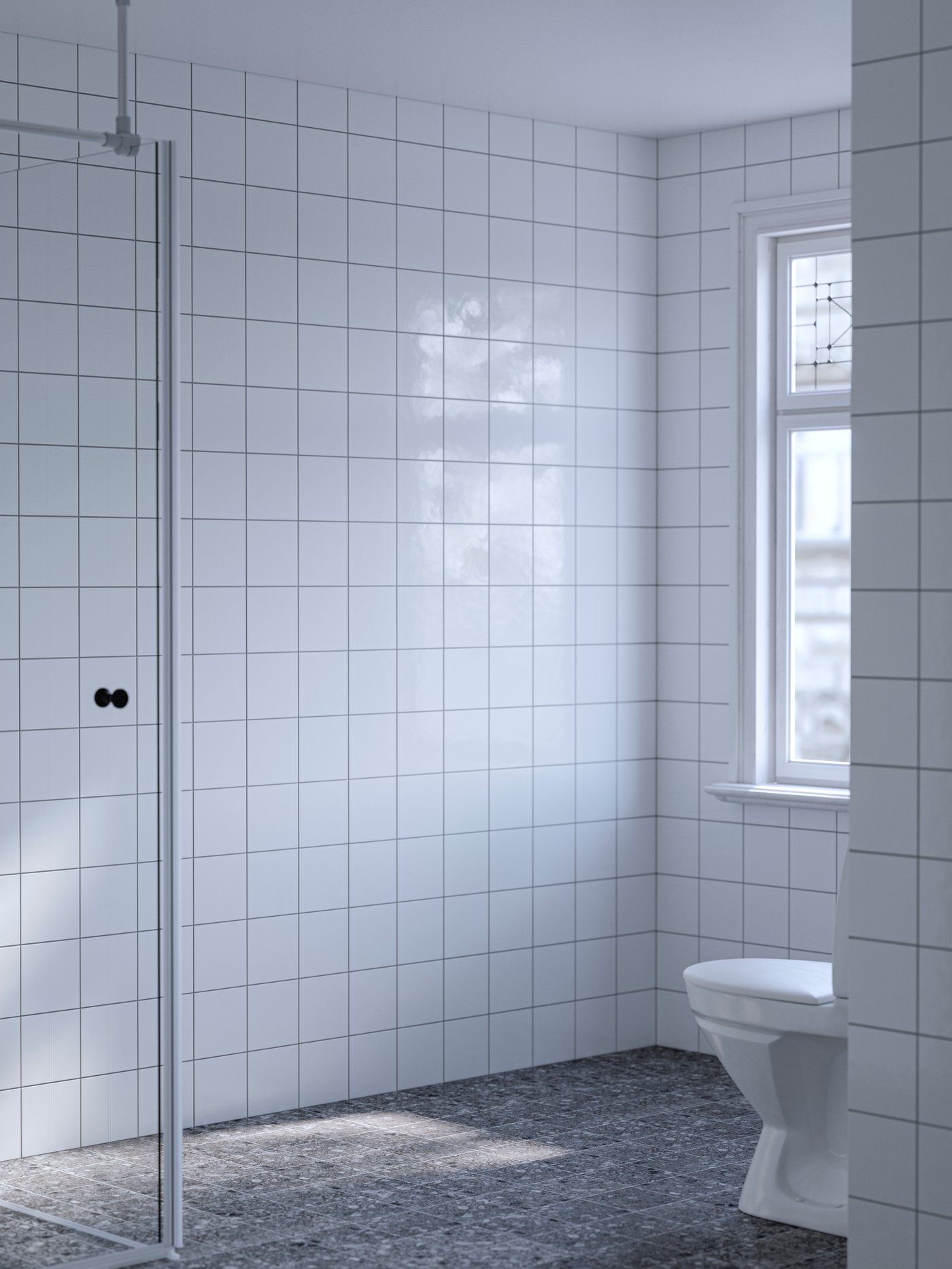 An otherwise empty, white-tiled bathroom with grey floor has a window and a toilet and a shower door placed in a corner.