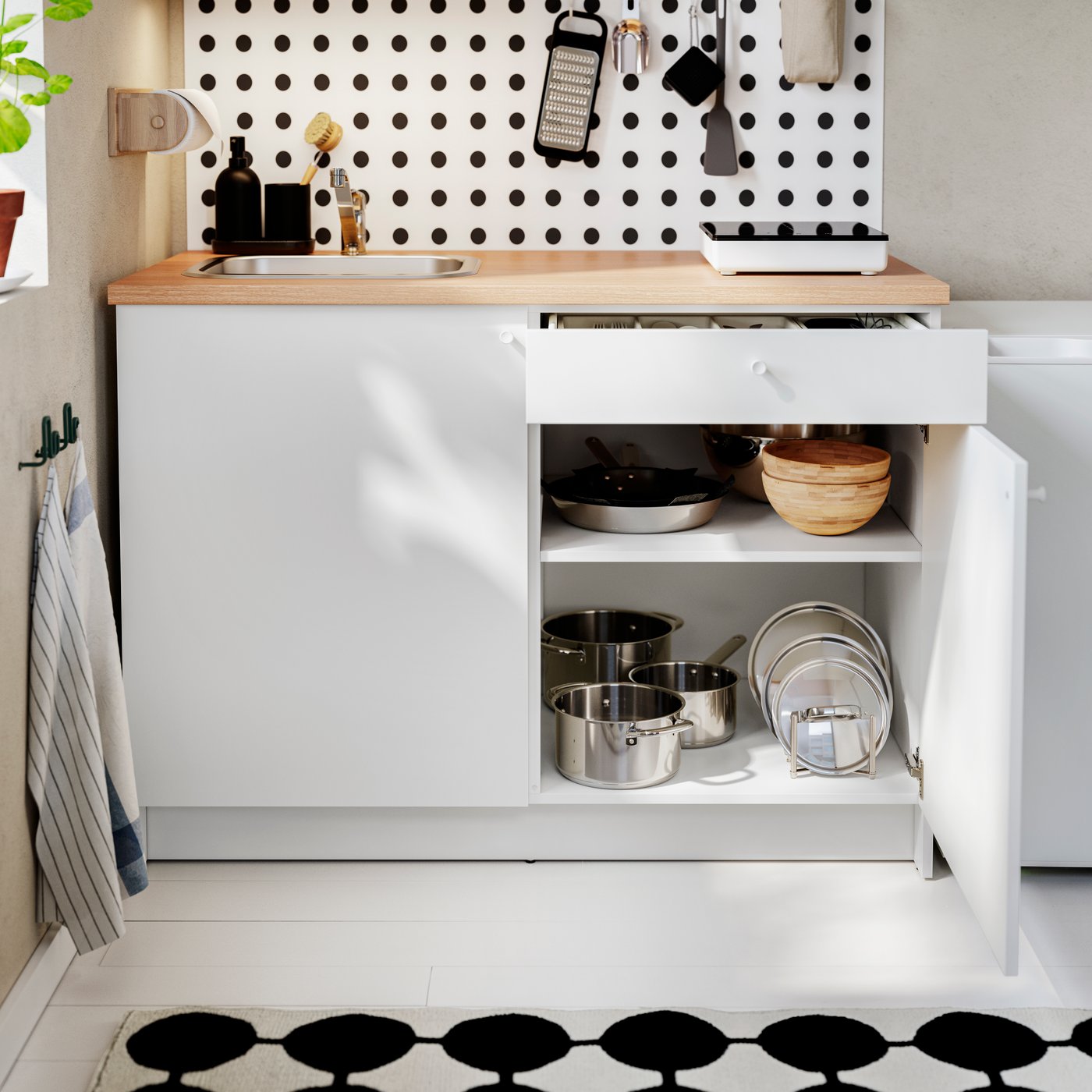 A white KNOXHULT base cabinet with doors and drawer
