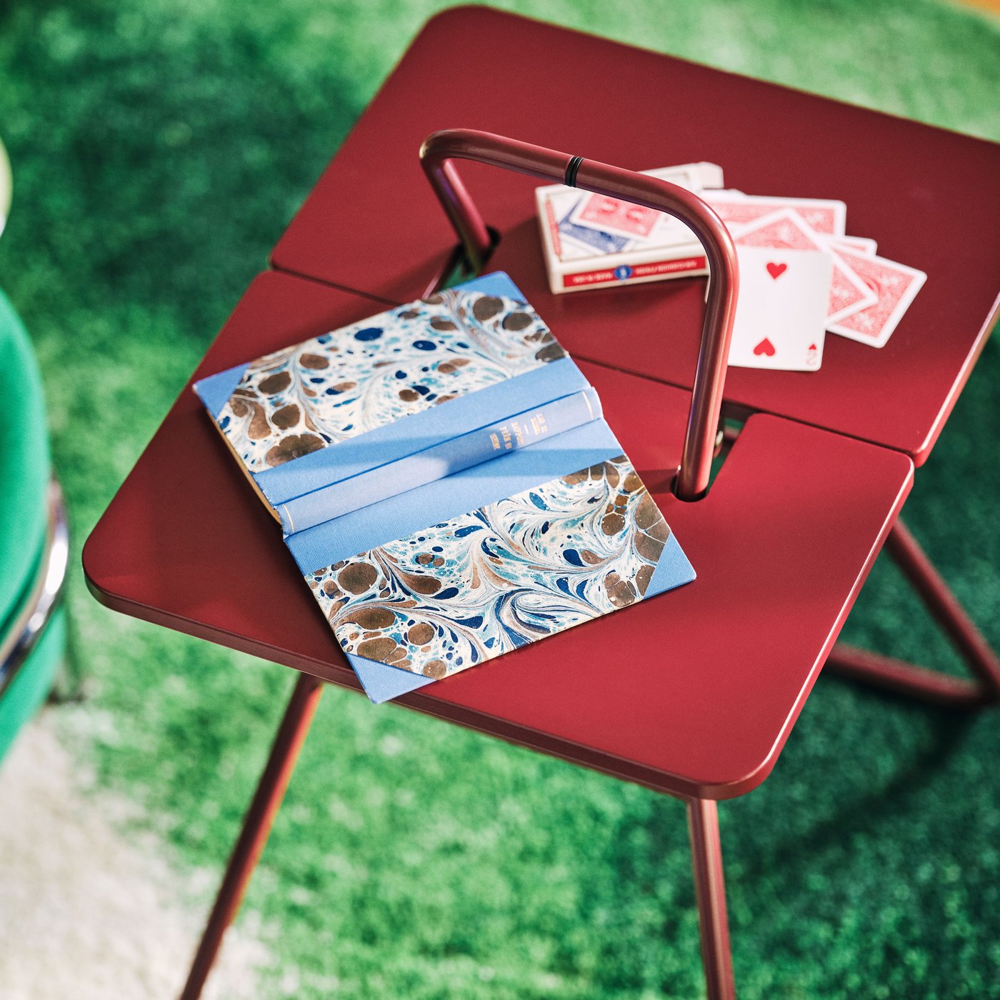 A dark red IKEA PS 2026 side table