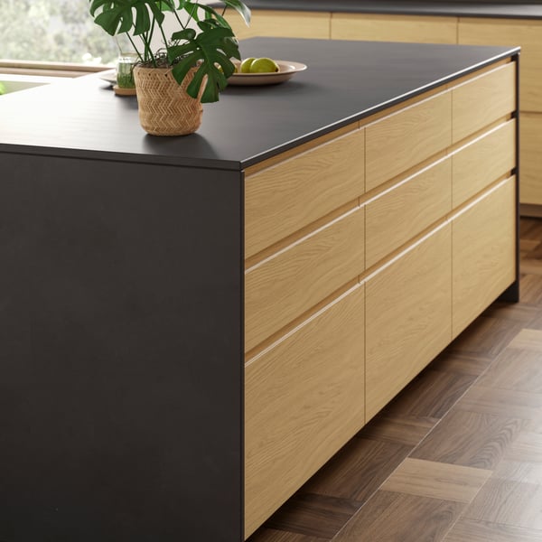 A kitchen island with storage and a MÖCKLARP/RUNBÄCK high pressure porcelain worktop.