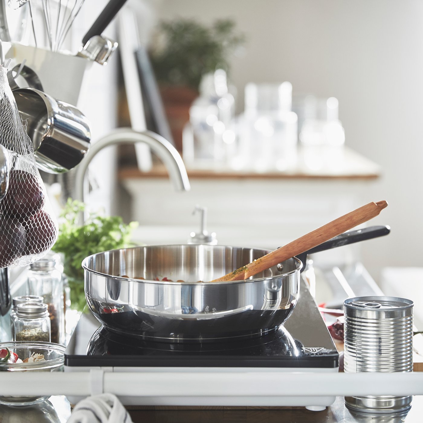 A clear glass/stainless steel MIDDAGSMAT sauté pan with lid