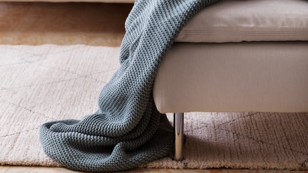 Een beige TVERSTED vloerkleed, laagpolig