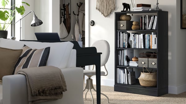 A black HAVSTA shelving unit with plinth