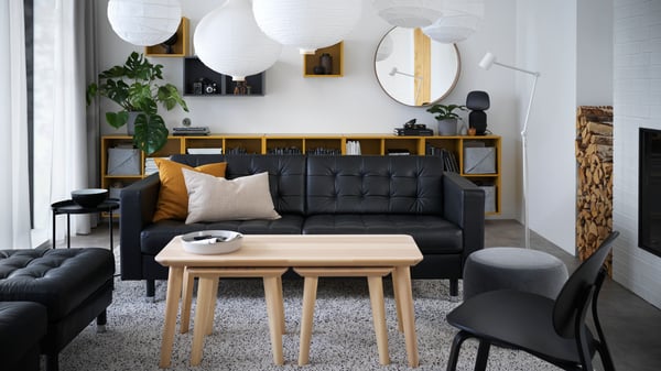 A dark golden-brown VIGDIS cushion cover in the living room