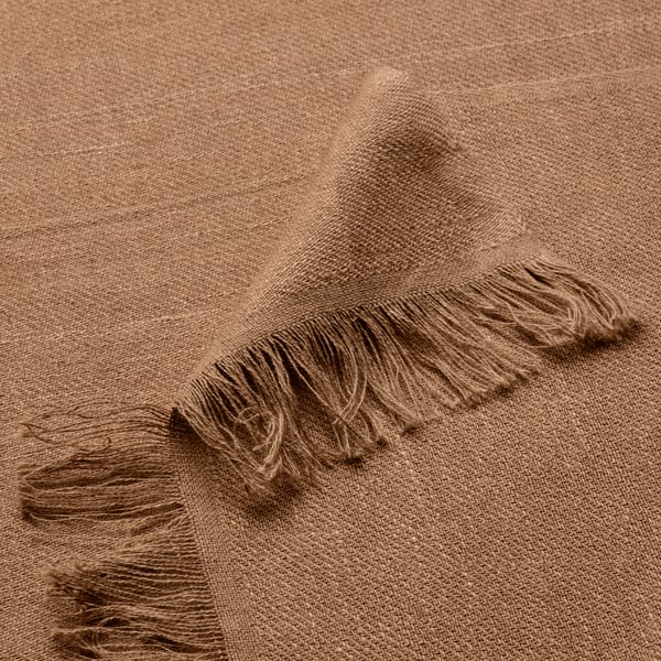 A light brown DYTÅG throw