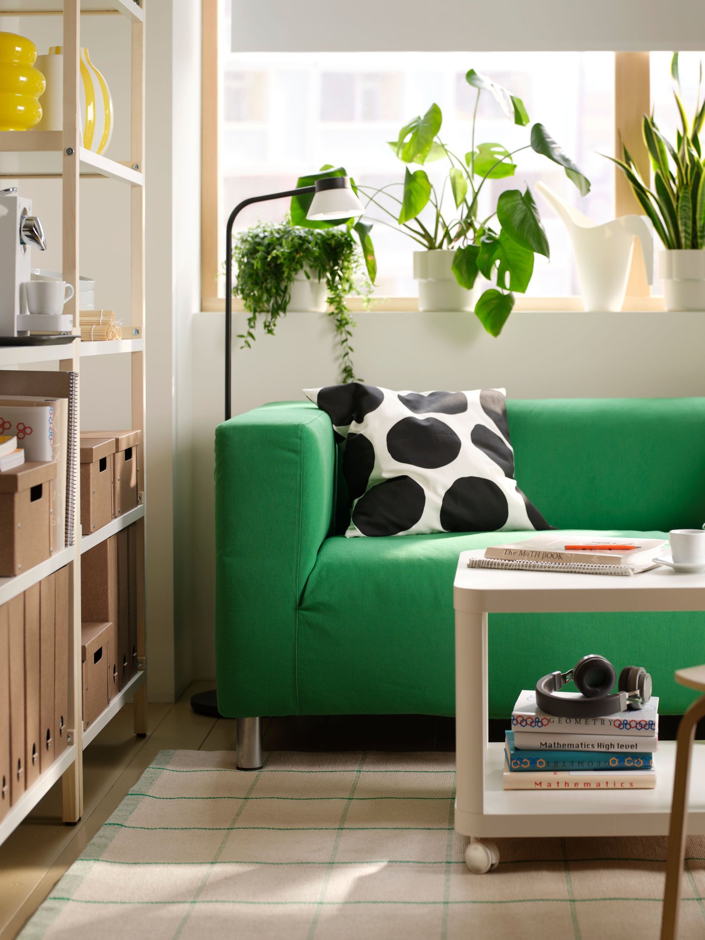 A Vissle green KLIPPAN 2-seat sofa in the living room