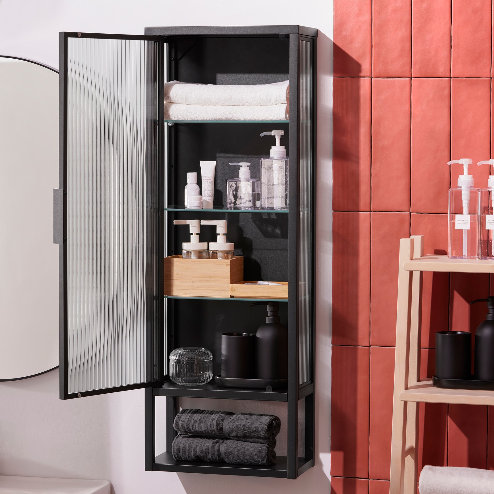 An anthracite MOSSJÖN wall cabinet w shelves/glass door