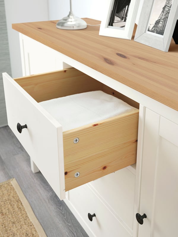 A white stain/light brown HEMNES sideboard