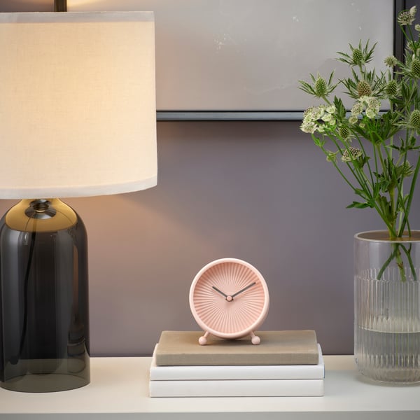 A pale pink SNOFSA table clock