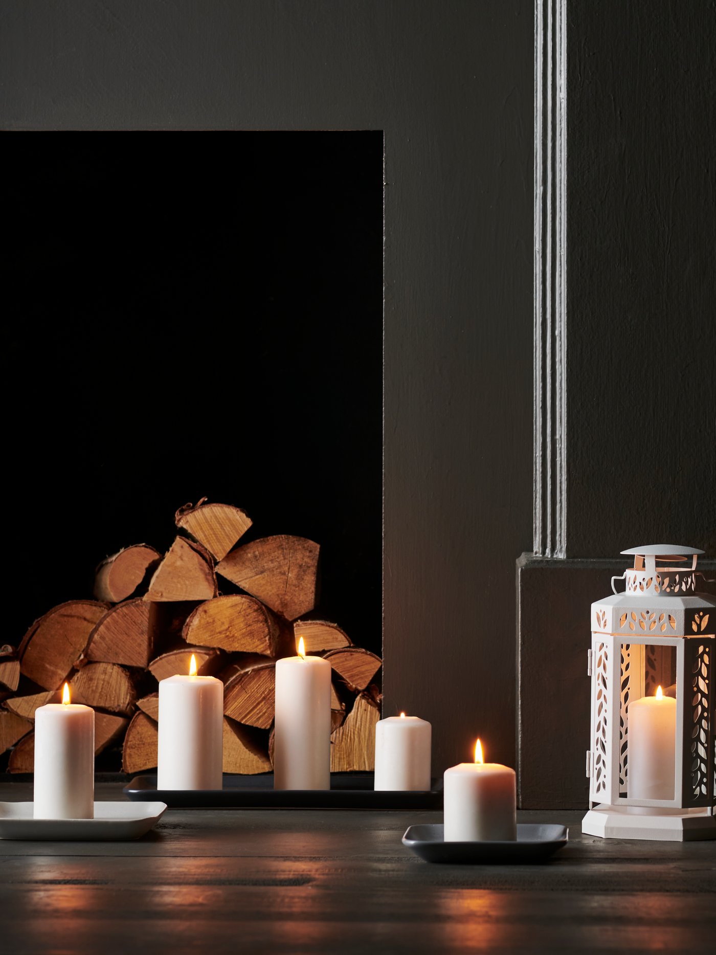 A white ENRUM lantern f block candle, in/outdoor in the living room