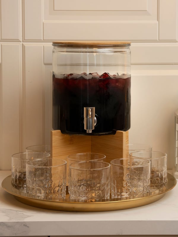 A bamboo ÖGONTRÖST stand for jar with tap