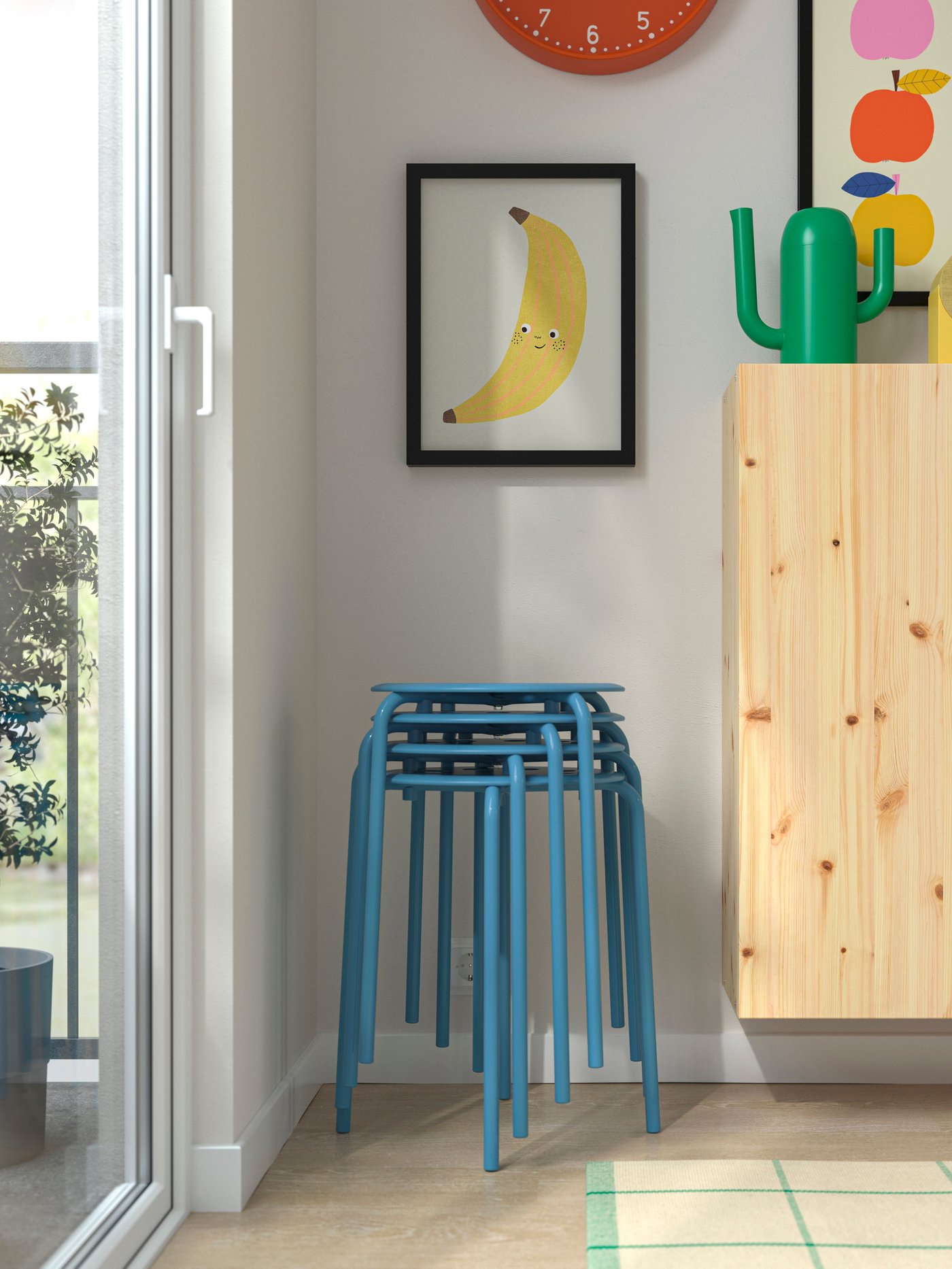 A blue MARIUS stool in the dining room