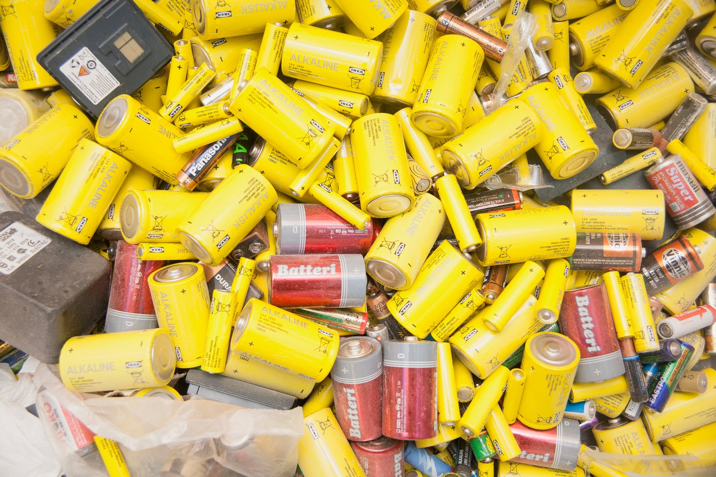 Several batteries all collected to be recycled.