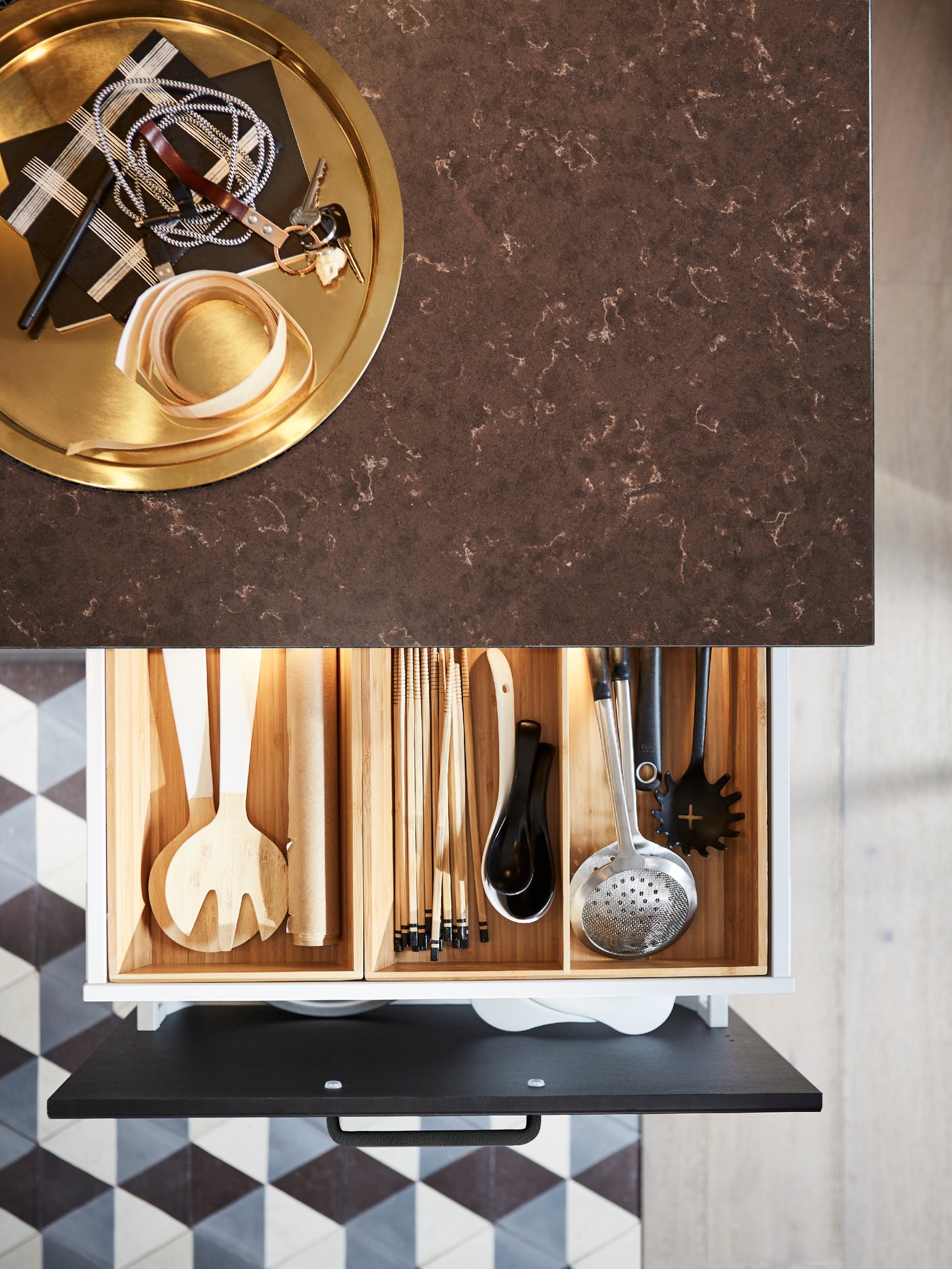 A stainless steel GRUNKA 4-piece kitchen utensil set in the kitchen