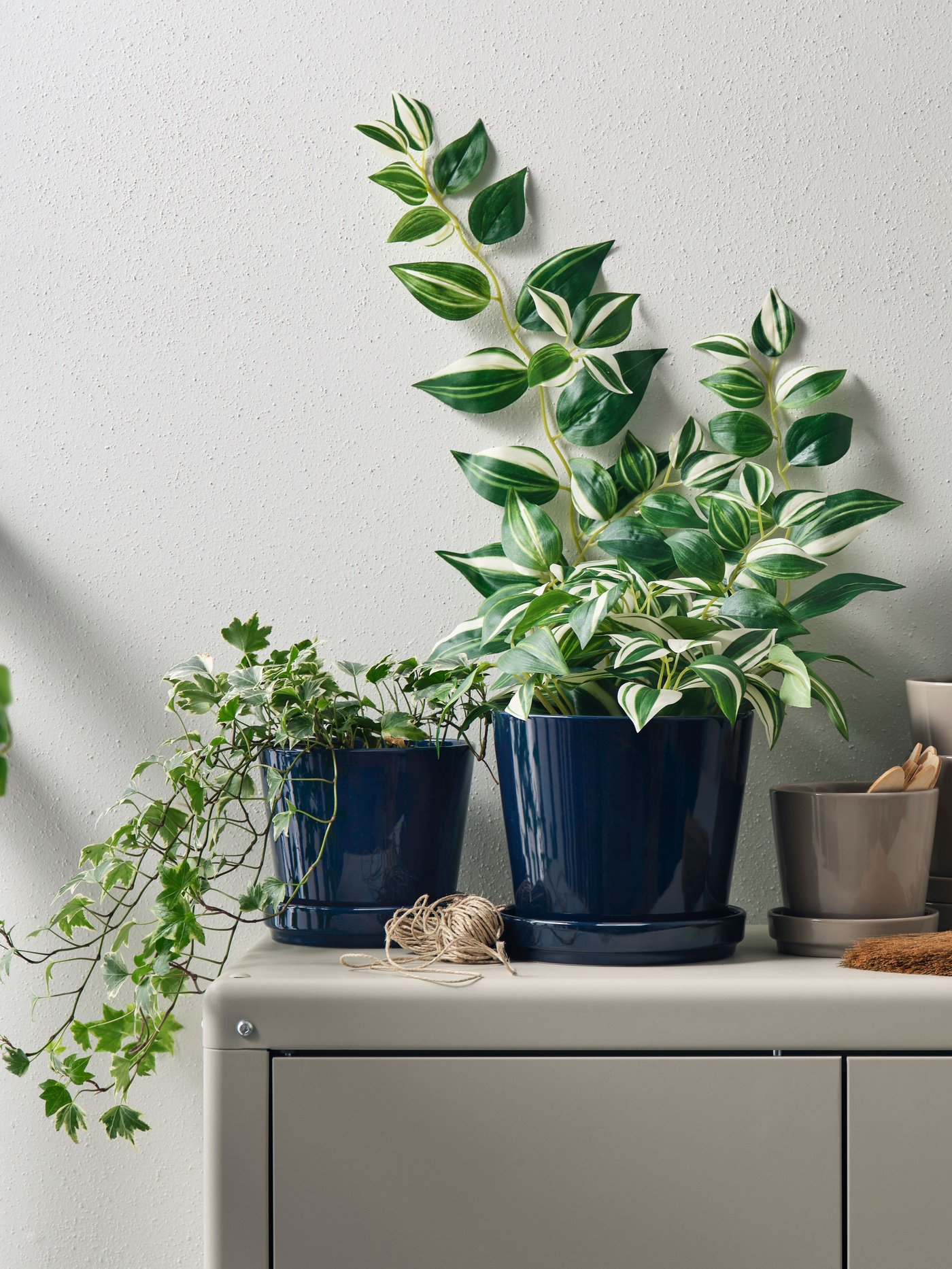 An in/outdoor/black-blue KLOTLÖNN plant pot with saucer