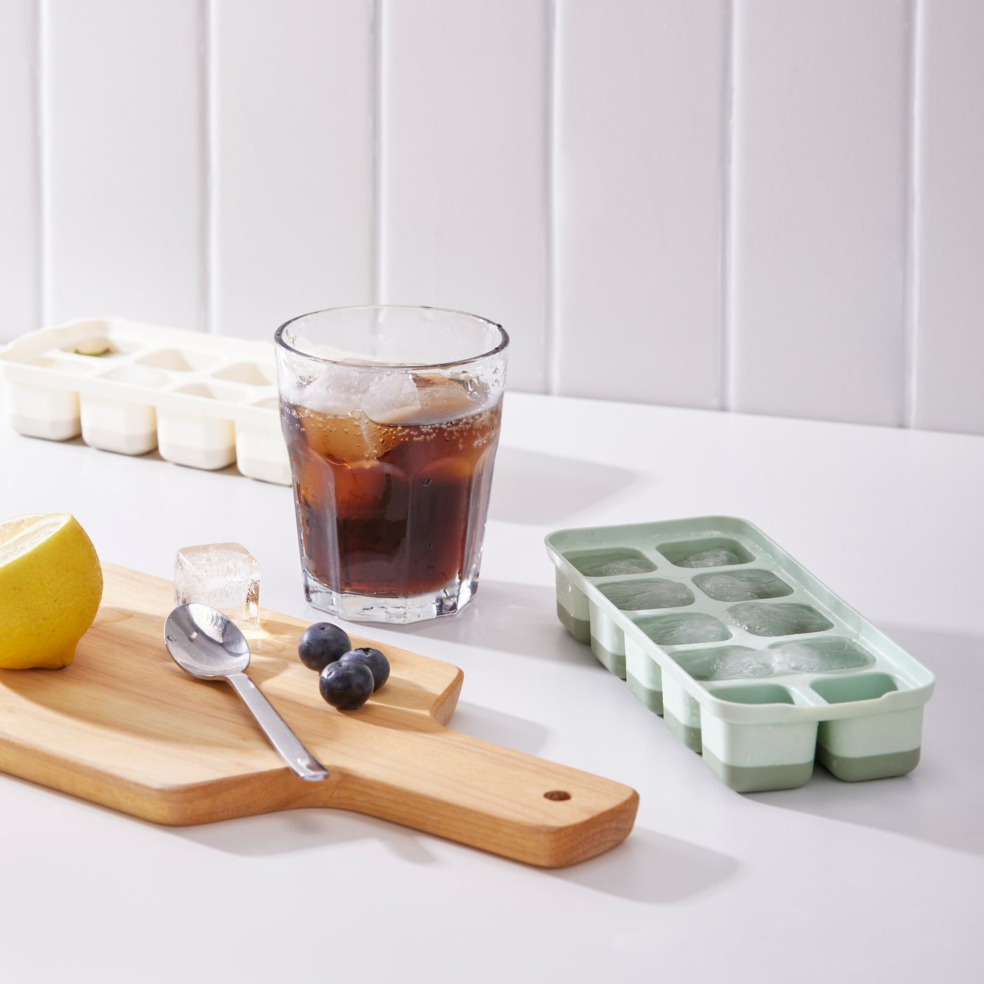A mixed colours SPJUTROCKA ice cube tray with lid