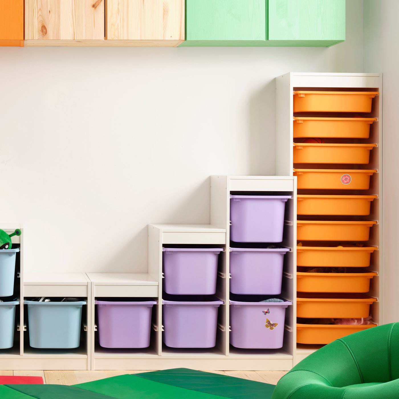 A light white stained pine TROFAST wall storage in the childrens room