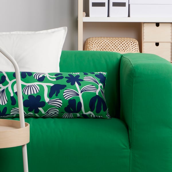 A bright green/dark blue SANDMOTT cushion