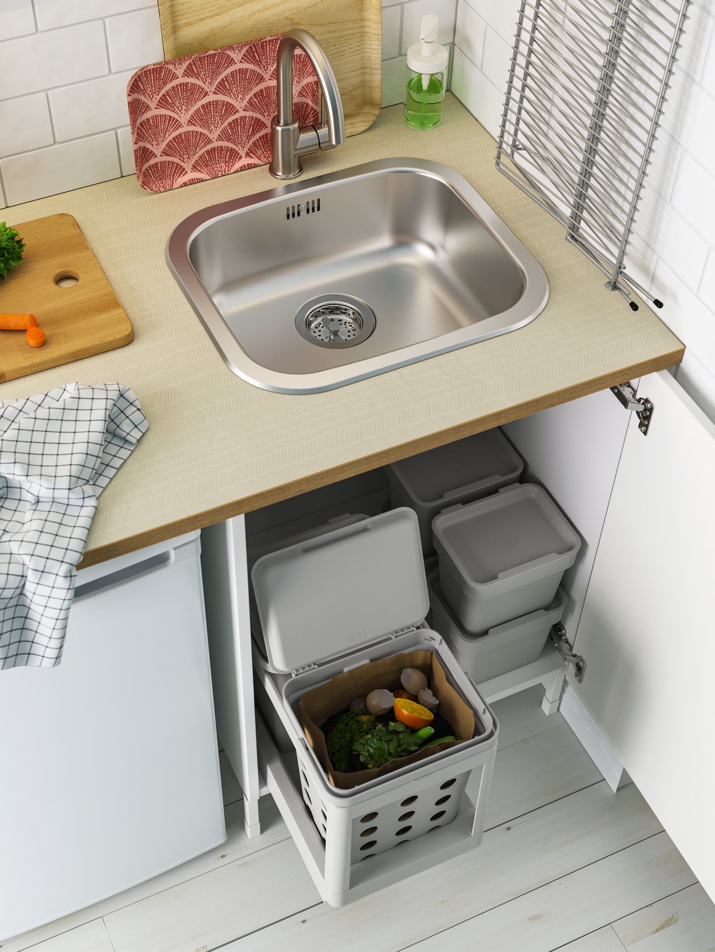 A white/dark grey/patterned RINNIG tea towel in the kitchen