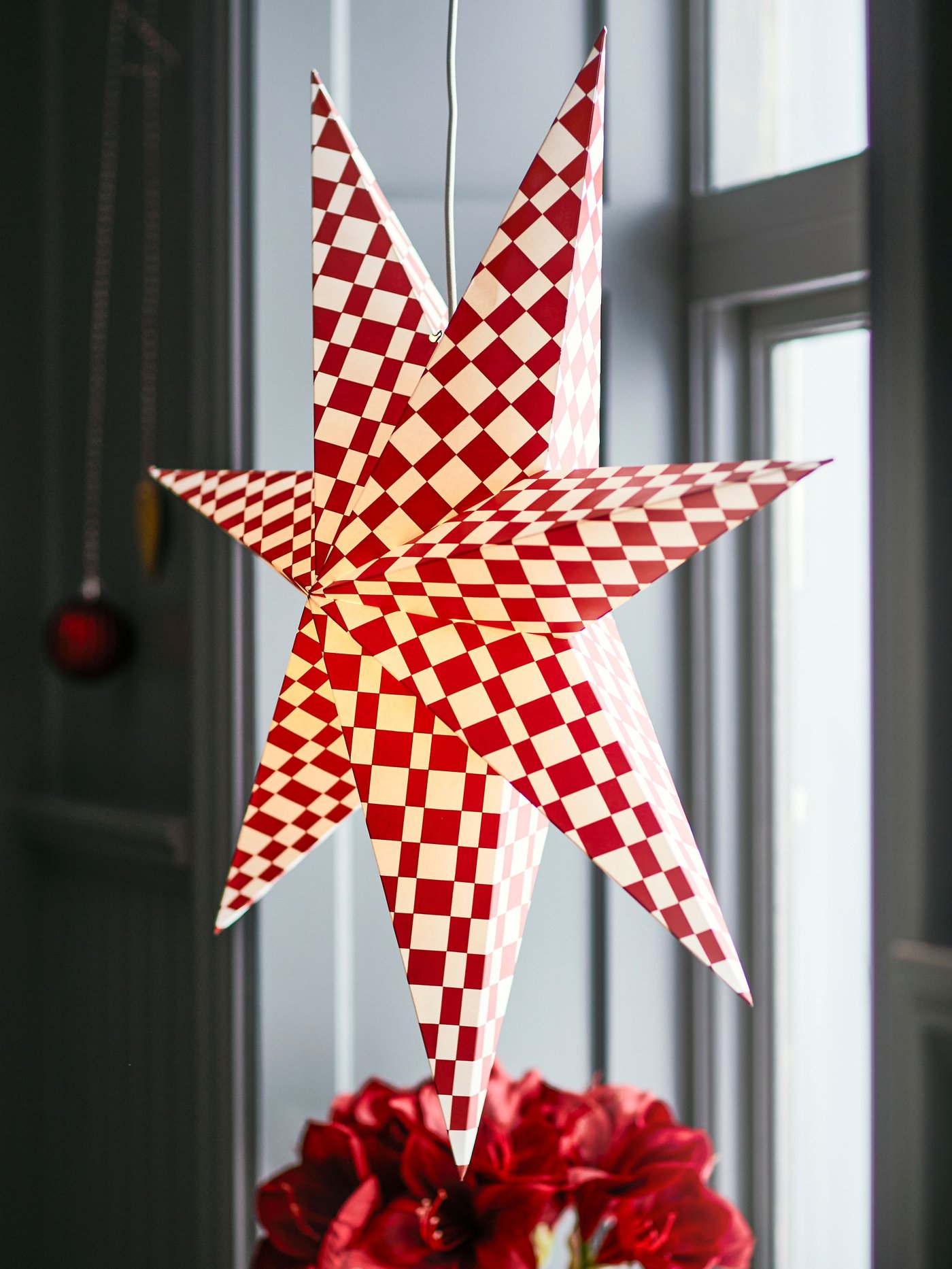 A red/white STRÅLA lampshade