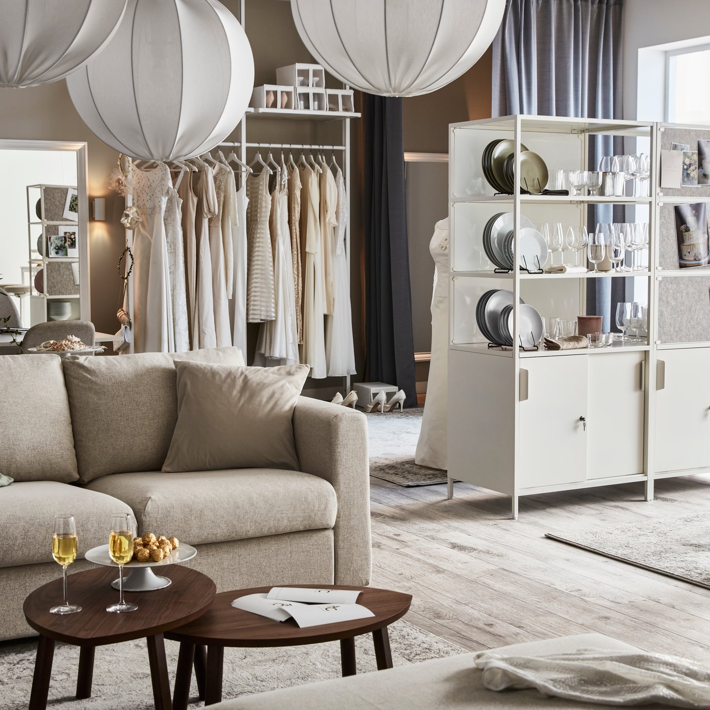 A walnut veneer STOCKHOLM nest of tables in the living room
