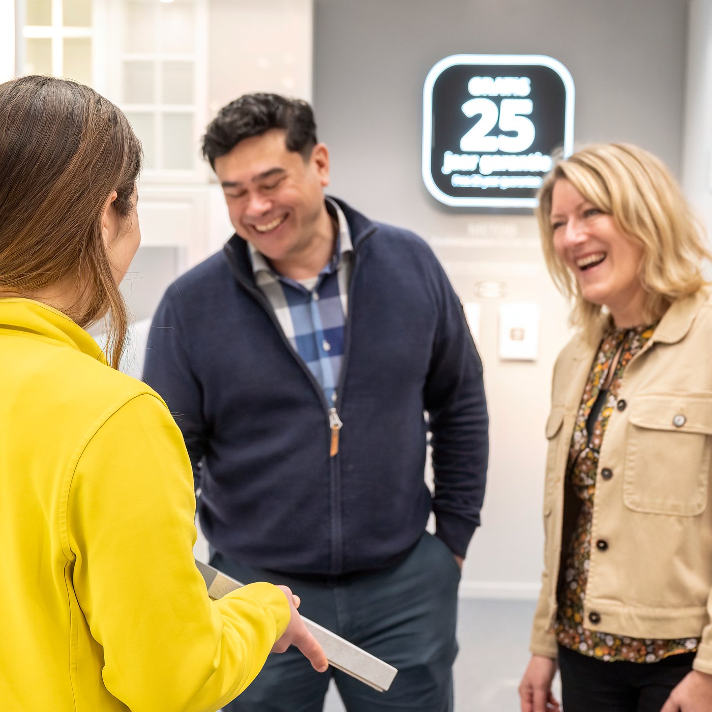 An IKEA Co-worker helping customers plan their dream kitchen