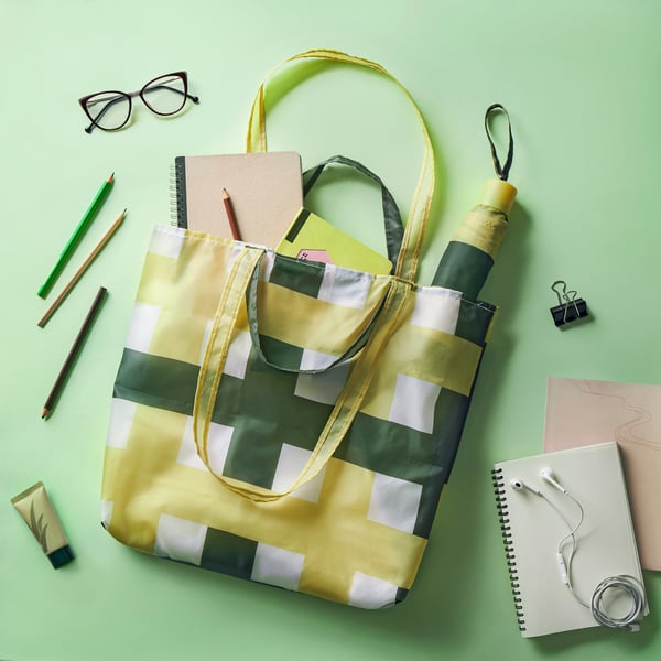 A white/multicolour SKYNKE carrier bag