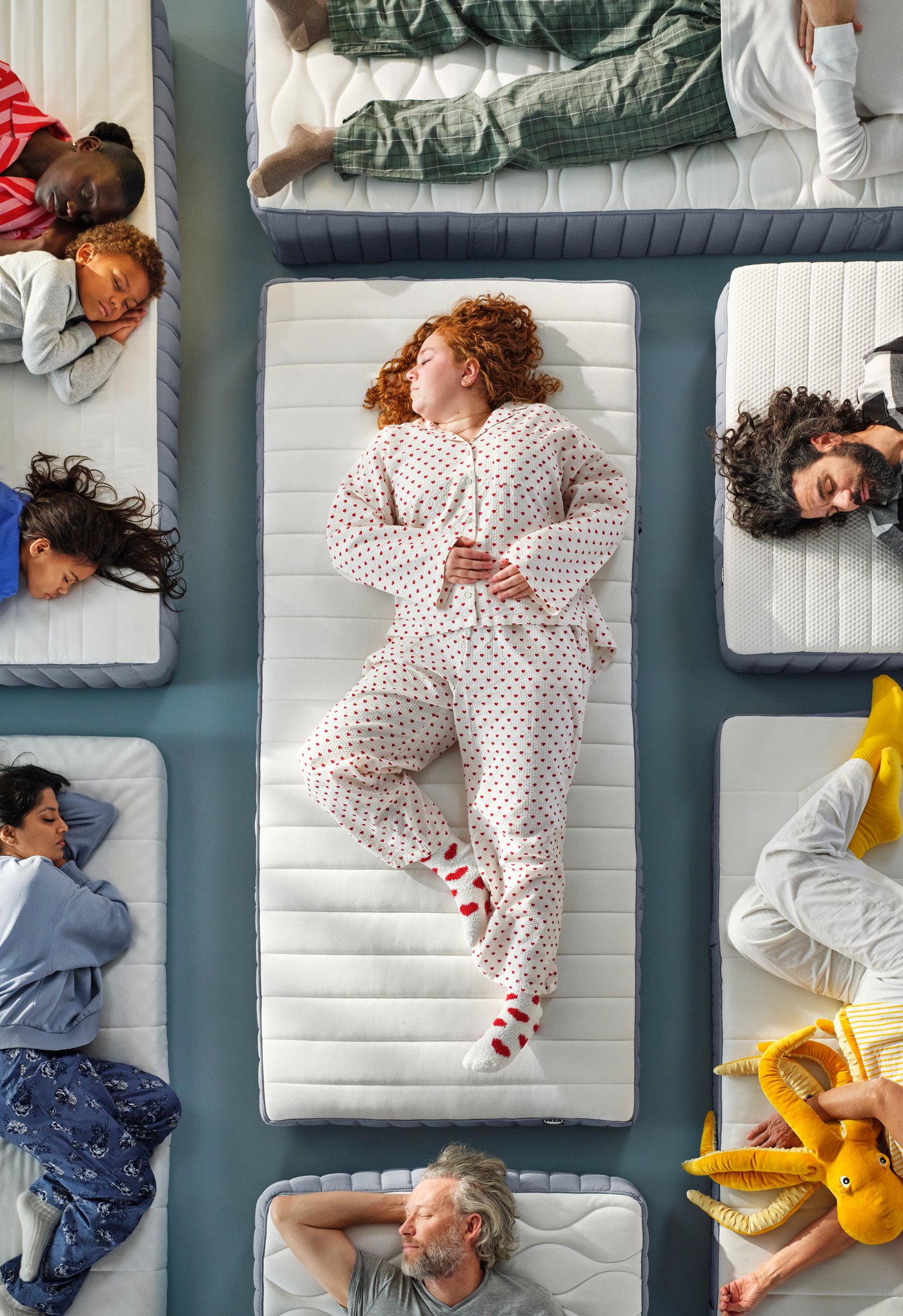 A firm/light blue VALEVÅG pocket sprung mattress