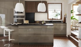 A high-gloss dark grey-brown VOXTORP drawer front