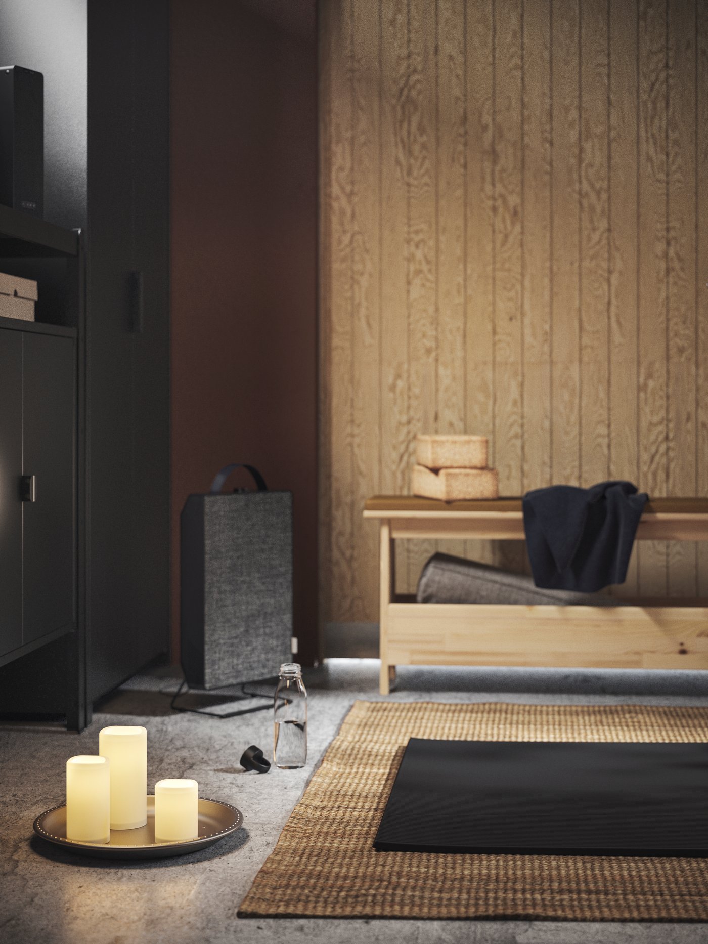 A mood-lit corner with a LOHALS rug flanked by a FÖRNUFTIG air purifier, LED block candles and a PERJOHAN bench with storage.