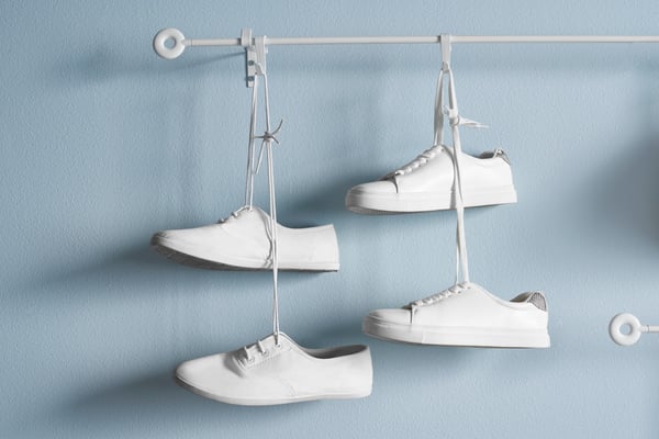 A white IRJA curtain rod set in the hallway